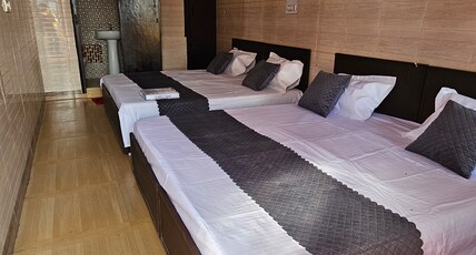 BHAGAT HOME STAY Room Type - QUADE ROOM