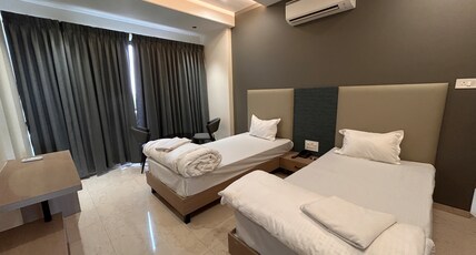 ATHARAV HOTELS Room Type - Deluxe Twin AC Room