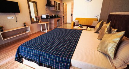 Richa's Home| Gaur City Mall Room Type - Premium Studio Apartment | Balcony and Kitchenette