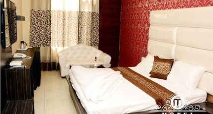 Hotel MG Grand Room Type - Deluxe Room (Only Veg Food available with CP and MAP)