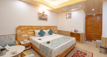 Snow Peak Retreat & Cottages (Centrally Heated- Hill View) Room Type - Deluxe Room (without balcony) Air Conditioned-Centrally Heated Snow Peak Retreat & Cottages (Centrally Heated- Hill View) Room Type - Deluxe Room (without balcony) Air Conditioned-Centrally Heated