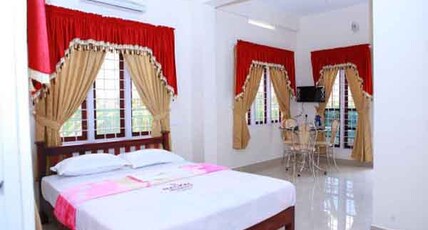 Mackal Residency  Room Type - AC Family Deluxe Room