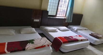 Hotel Shri Gajanan and Restorent Room Type - AC ROOM FOR 6 PERSON ONLY 02 KING SIZE BED AND ONE QUEEN SIZE BED Hotel Shri Gajanan and Restorent Room Type - AC ROOM FOR 6 PERSON ONLY 02 KING SIZE BED AND ONE QUEEN SIZE BED