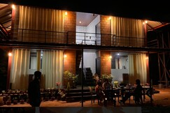 Tranquil glass house by Coorg Tree House