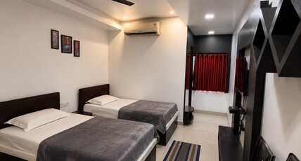 HOTEL SRI GANESH JI Room Type - Super Deluxe Room - AC