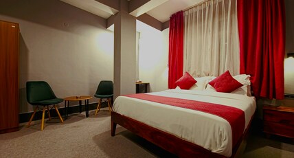 Mayuri Lodge Room Type - Room no 15. Luxury economy. Fully carpeted. Warm cozy colors and design,  10inch spring mattress 