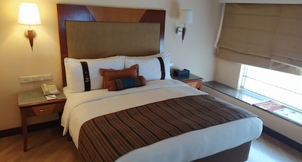 The Lalit Ashok Bangalore Room Type - Executive Club King Bed Room , SitOut, Pool view facing The Lalit Ashok Bangalore Room Type - Executive Club King Bed Room , SitOut, Pool view facing