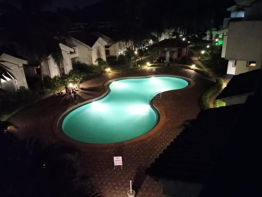 AirStay 1BHK Apartement in Arpora | Shared Pool - Tap to explore photos