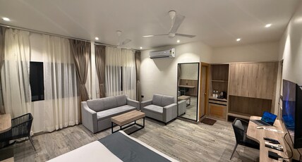 Firangipani Eco Suites Room Type - Luxury Suite with 43 Inch Smart TV, Sofa Cum Bed Firangipani Eco Suites Room Type - Luxury Suite with 43 Inch Smart TV, Sofa Cum Bed