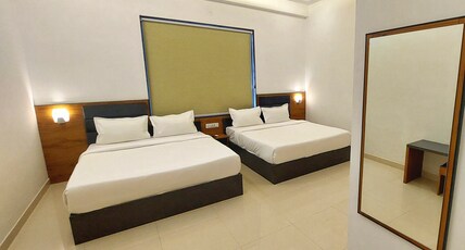 Shri Ram Portico Room Type - Standard Family Room ( 2 Double Bed | 4 Pax )