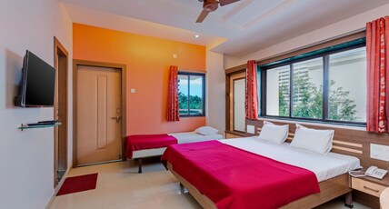 Sai Prarthana Inn Room Type - Three Bed Deluxe