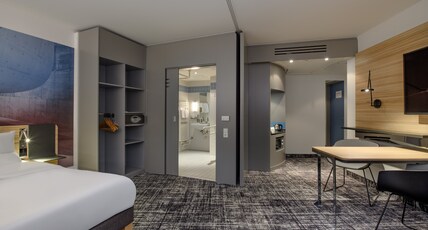 NOVOTEL SUITES BER POTSDAMER PL Room Type - Standard Suite: double bed, sofa bed, small kitchenette suitable for guests with limited NOVOTEL SUITES BER POTSDAMER PL Room Type - Standard Suite: double bed, sofa bed, small kitchenette suitable for guests with limited