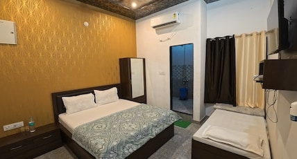 Hotel Daksh (Free Gated Parking & 10 Min walk from Temple) Room Type - Super Deluxe Triple Room ( 1 Double Bed + 1 Single Bed ) Hotel Daksh (Free Gated Parking & 10 Min walk from Temple) Room Type - Super Deluxe Triple Room ( 1 Double Bed + 1 Single Bed )