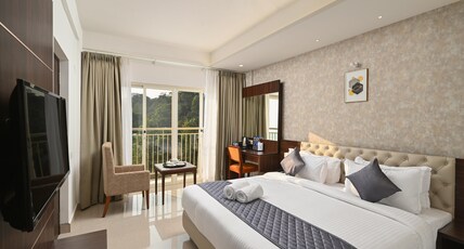 Golden Munnar Palace By Hawk Hospitality Room Type - Golden Executive Non-AC with Balcony