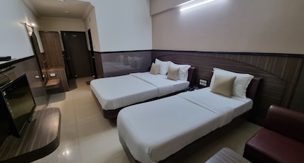 Damji Hotel Room Type - 3 Bedded AC Family Room (Price is for 3 Adults) Damji Hotel Room Type - 3 Bedded AC Family Room (Price is for 3 Adults)