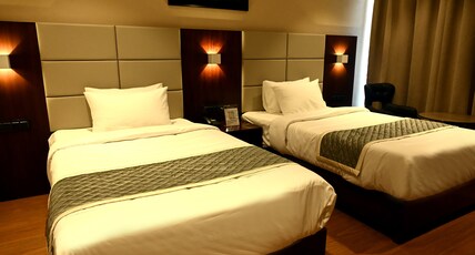 HOTEL SHARADA ELITE Room Type - TWIN SHARE ROOM