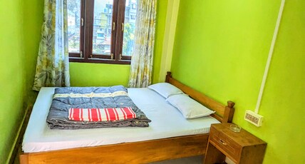 Sang dorje homestay Room Type - Queen bed deluxe room with balcony view Sang dorje homestay Room Type - Queen bed deluxe room with balcony view