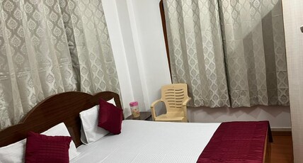 New Mahavir Room Type - Bedroom 1