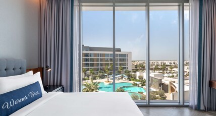 The WB Abu Dhabi, Curio Collection by Hilton - Free Theme Park Tickets Room Type - KING ARTIST POOL VIEW ROOM