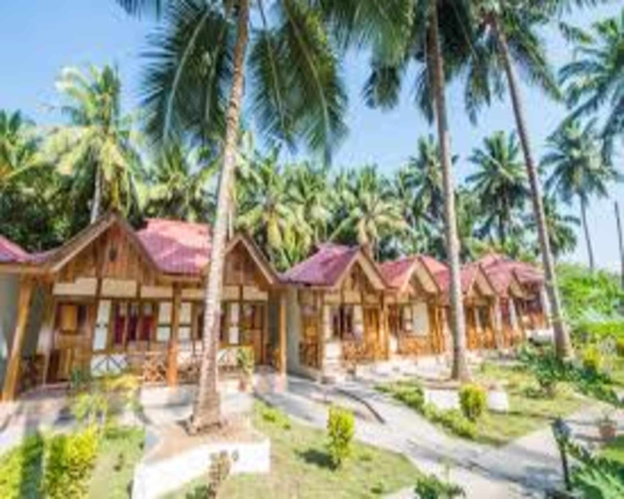 Coral Garden Beach Resort - Tap to explore photos