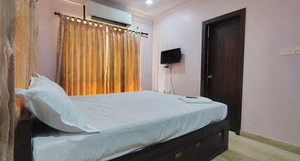 Star Spandan Inn Near Axis Mall Room Type - Deluxe Room with King Bed and AC