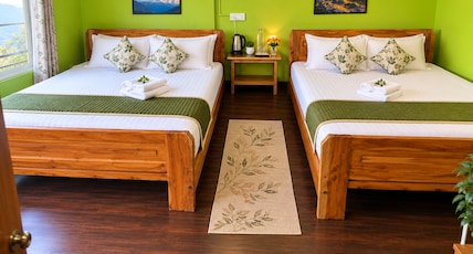 Eagle Point Homestay | Rajbari Room Type - Deluxe Quadruple Family Room with balcony ( Kanchenjunga and Darjeeling town view ) Eagle Point Homestay | Rajbari Room Type - Deluxe Quadruple Family Room with balcony ( Kanchenjunga and Darjeeling town view )