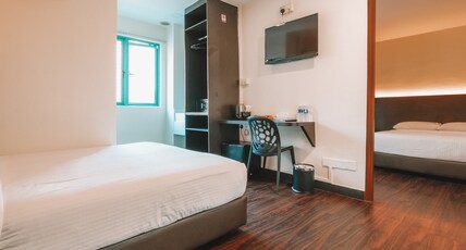 A Hotel Desker Room Type - Connecting Room, Window