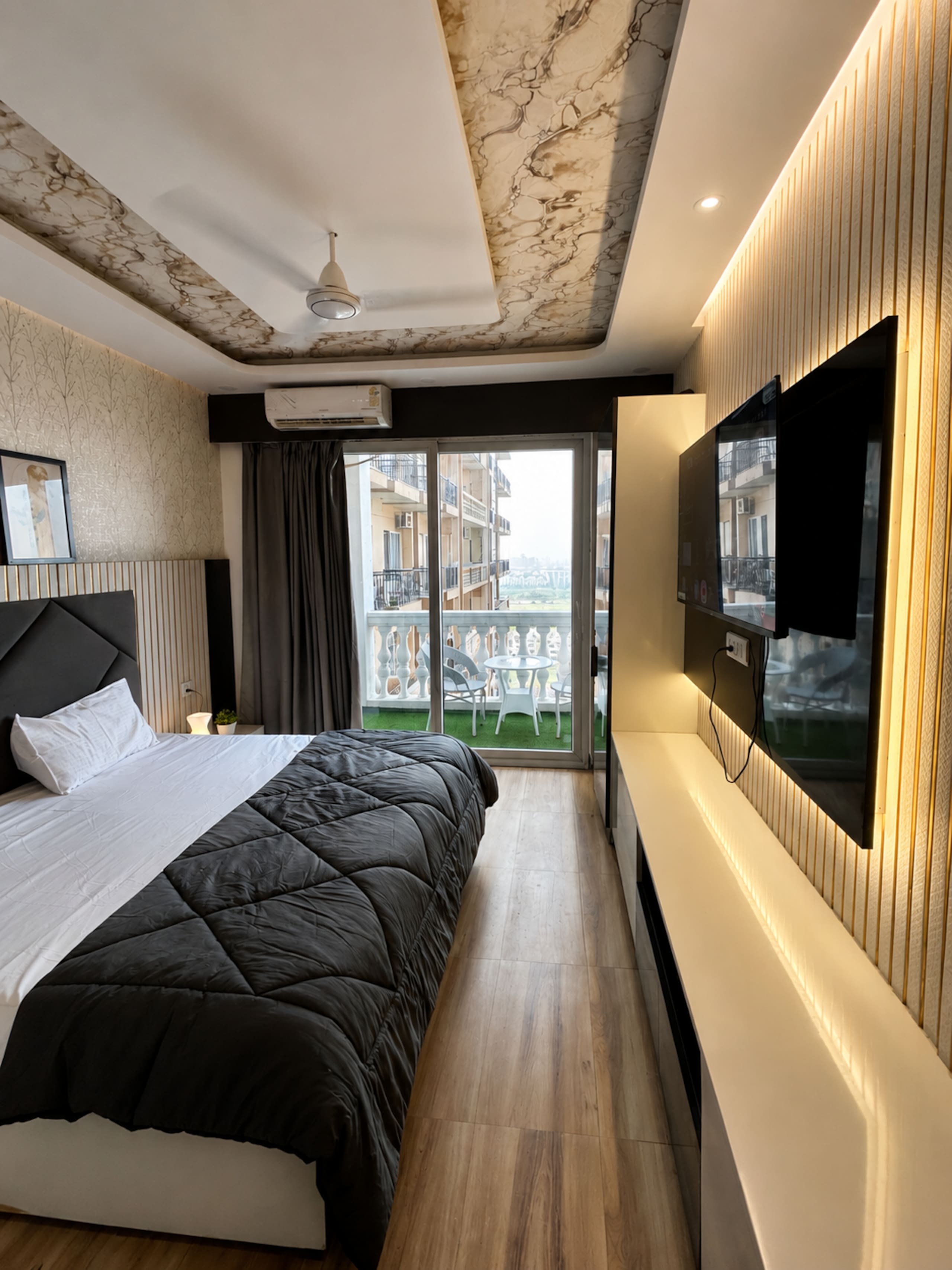 Onyx Suite Near India Expo Mart | Couple Friendly - Tap to explore photos