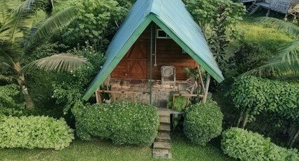 Okegiga Homes. Room Type - Wooden Cottage AC king size bed