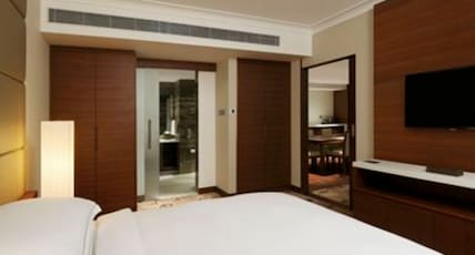Hilton Bangalore Embassy GolfLinks Room Type - Two Bedroom Luxury Suite with Living Room, Dining Area & Cocktail hours Hilton Bangalore Embassy GolfLinks Room Type - Two Bedroom Luxury Suite with Living Room, Dining Area & Cocktail hours