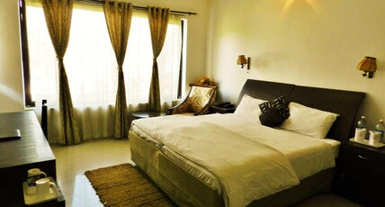 Hotel Van Durga Katra (10 mins Drive from Helipad) Room Type - Family Villa with two bedrooms with attached baths and common Living Room with view of Divine Yatra