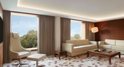 Hilton Bangalore Embassy GolfLinks Room Type - Two Bedroom Luxury Suite with Living Room, Dining Area & Cocktail hours Hilton Bangalore Embassy GolfLinks Room Type - Two Bedroom Luxury Suite with Living Room, Dining Area & Cocktail hours