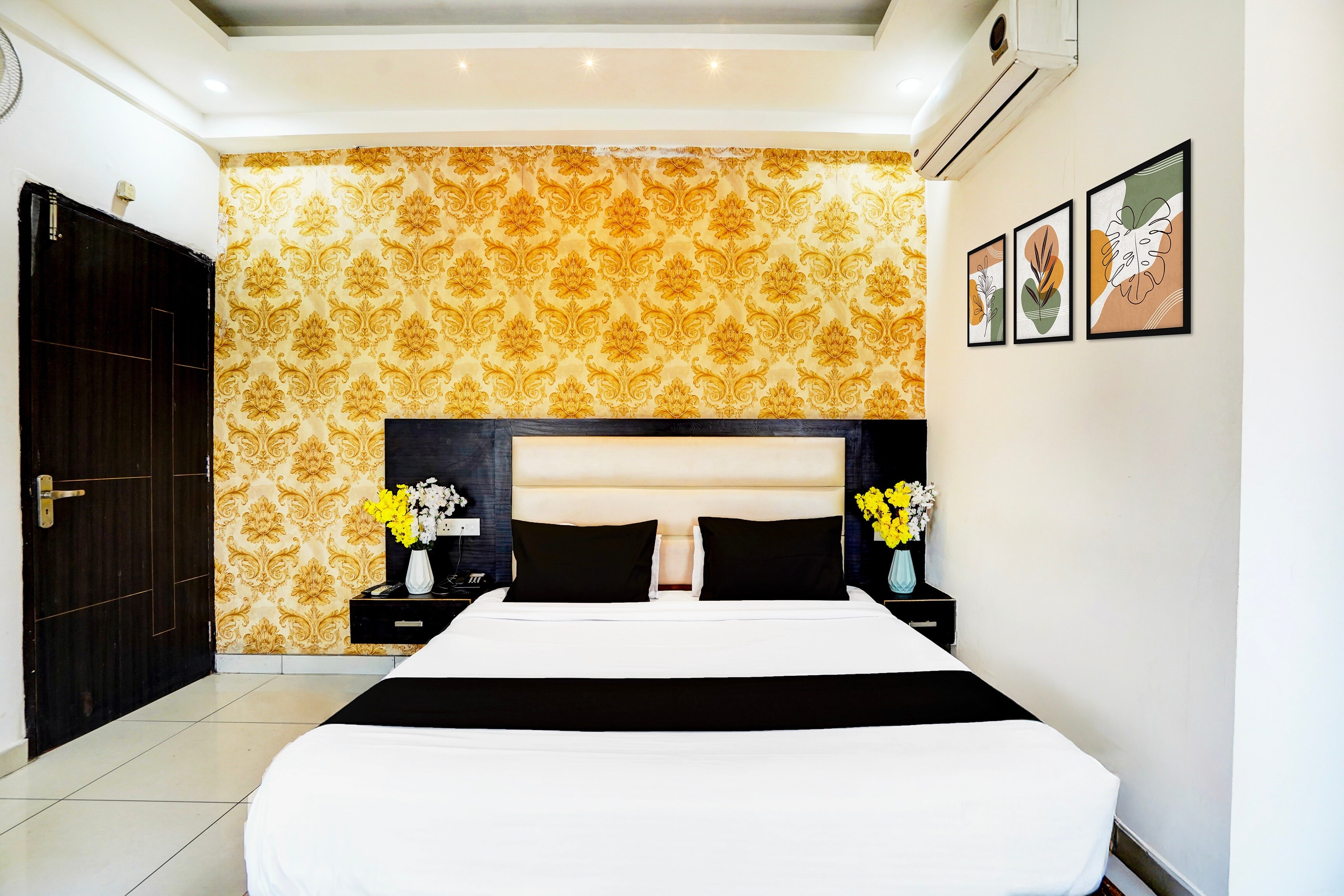 Collection O Surya Enclave Formerly Aroma Regency - Tap to explore photos