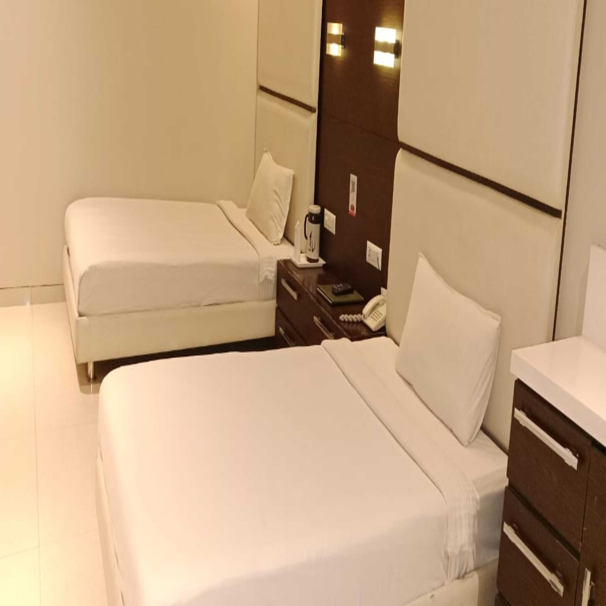 Hotel Rangoli Pearl - Tap to explore photos