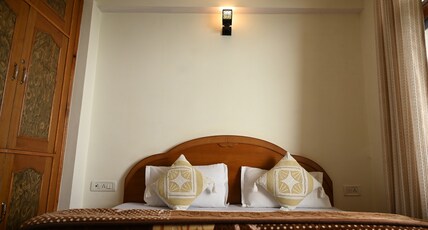 Satvik Homestay Room Type - Deluxe room with balcony and mountain view