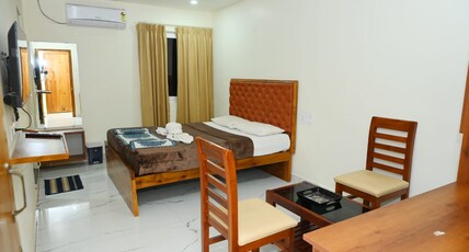 Om residency Room Type - Double Deluxe Ac