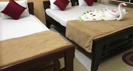 LAXMI VENKATESWARA HOTEL Room Type - Family Room AC-Two King Beds