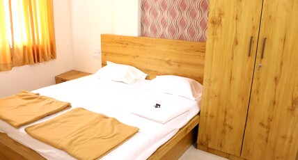 Prime Residency Room Type - Deluxe AC