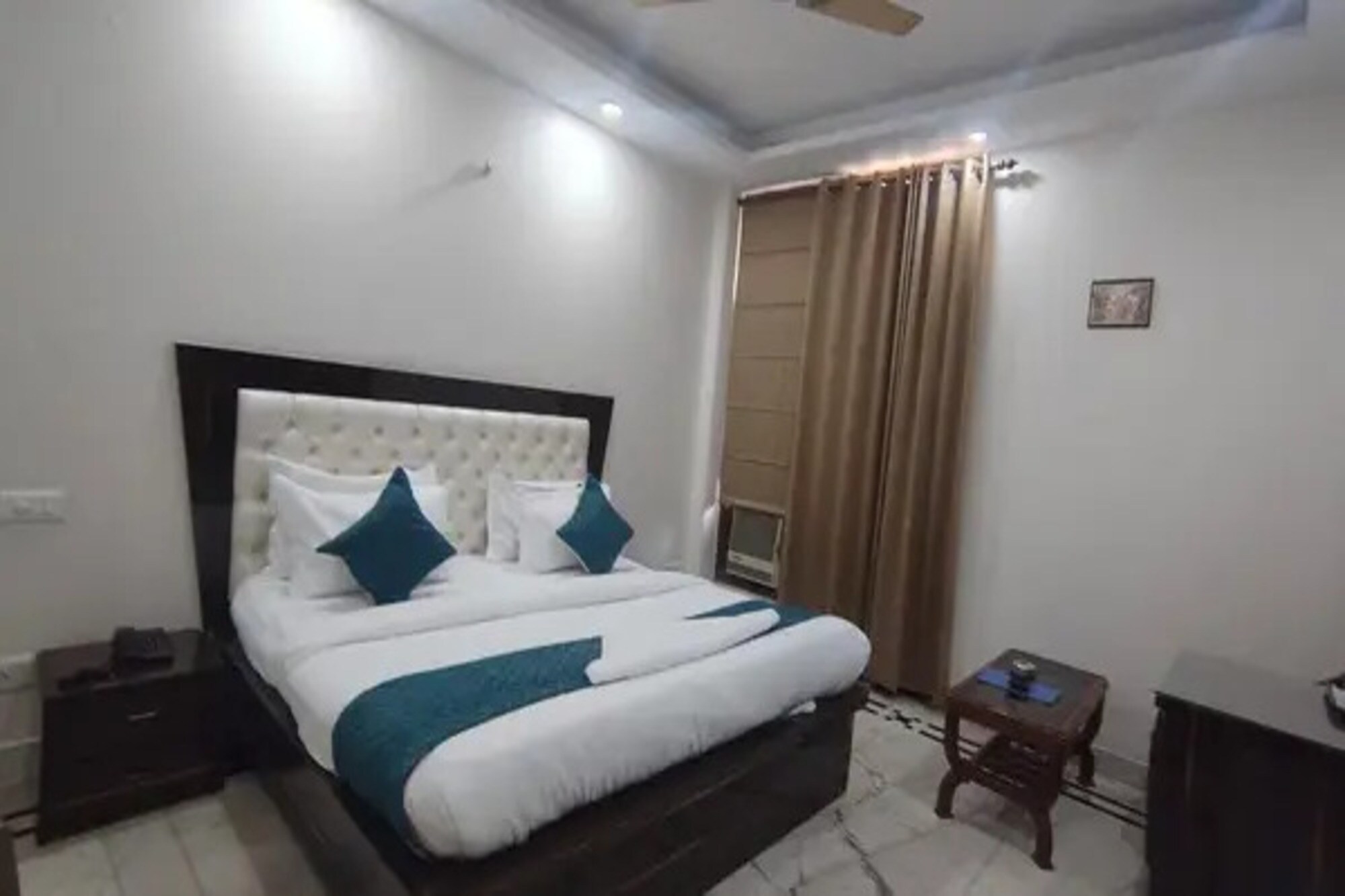 FabHotel The Arjun - Tap to explore photos
