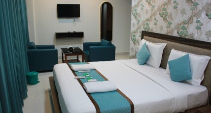 VAISHNAVI SUITES Room Type - Deluxe Room