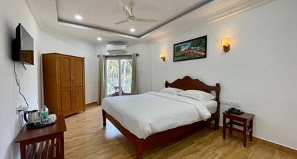 PALM PARADISE RESORT Room Type - Deluxe Room with AC and Balcony