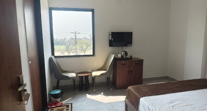 Hotel Yashoday Room Type - Premium Deluxe Room with Modern Amenities and City View