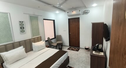 Hotel Yashoday Room Type - Premium Deluxe Room with Modern Amenities