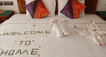 Ananda Holiday Home Room Type - Deluxe Double Room with Balcony.