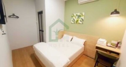 Hotel O Green Home Hotel Room Type - Deluxe Queen