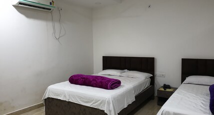 HOTEL SATYAM JAIGAON Room Type - Triple Deluxe Room NON AC
