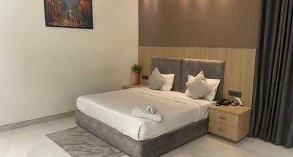 Amber Continental (Near Satellite Bus Stand). Room Type - Deluxe room
