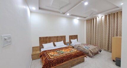 Shanti Maa Residence Room Type - Luxury Triple Bed Room with Balcony and Hill View Shanti Maa Residence Room Type - Luxury Triple Bed Room with Balcony and Hill View
