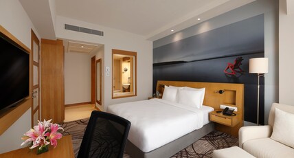 Novotel Hyderabad Convention Centre Room Type - Standard Queen Bed with Poolside View Novotel Hyderabad Convention Centre Room Type - Standard Queen Bed with Poolside View