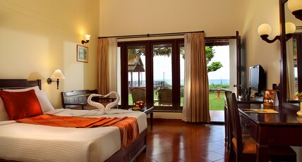 Abad Whispering Palms Room Type - Lake Facing Premium Cottage with Sitout